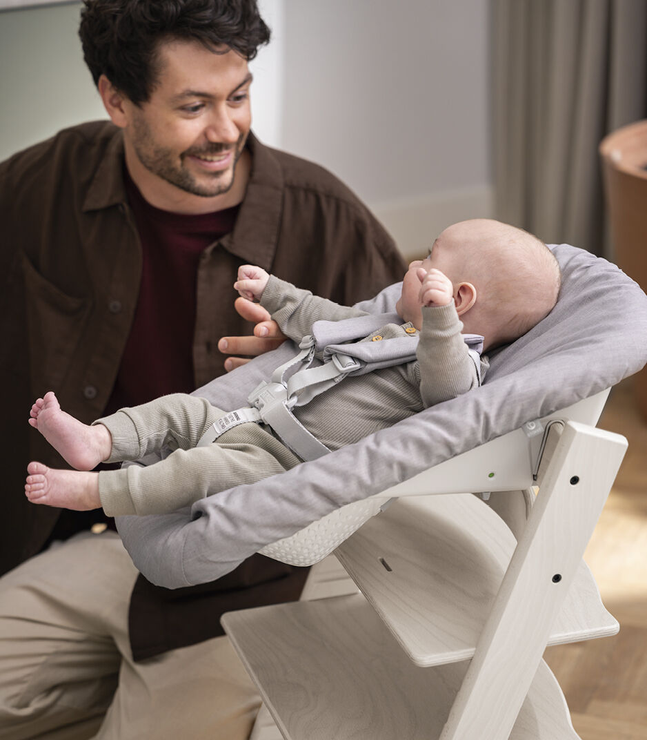 Tripp Trapp® Chair Whitewash with Newborn Set, Grey. Close-up.